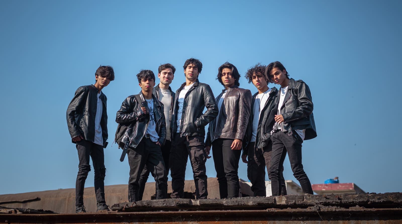 The Dynamite Crew dancers in black leather jackets on a Lahore rooftop
